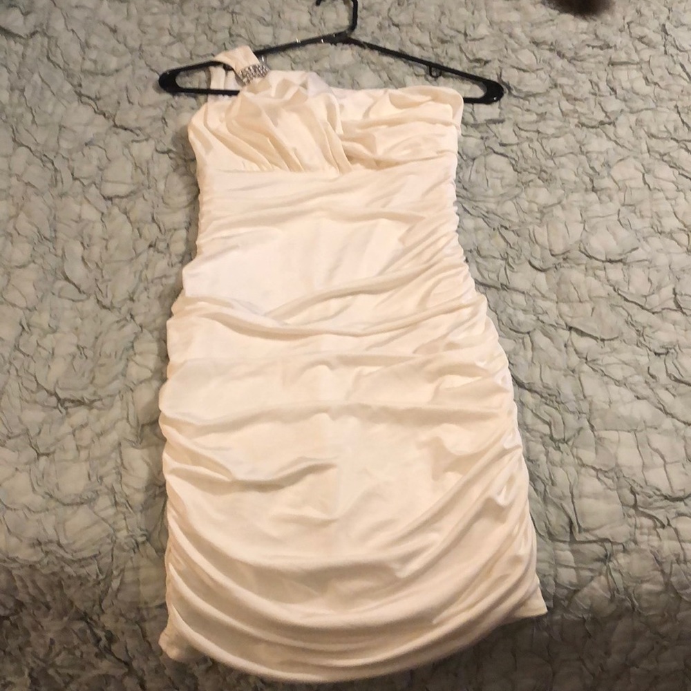One shoulder off white dress.